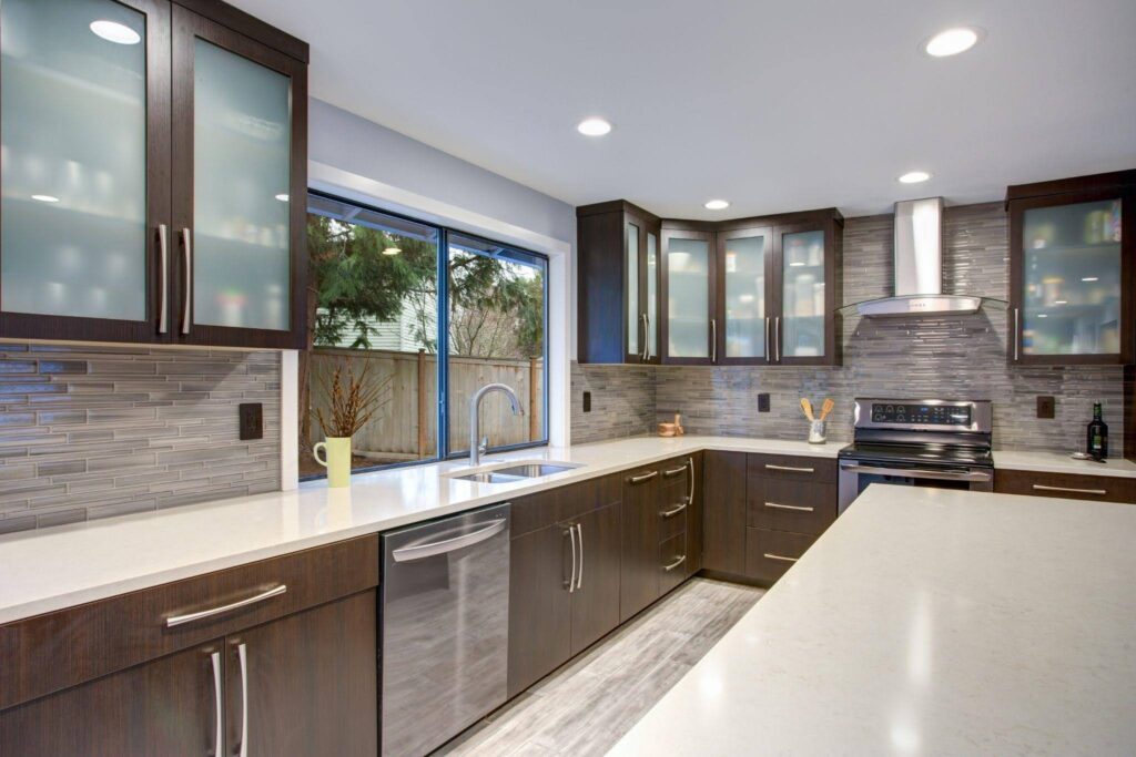 Spacious kitchen with a central island and contemporary stainless steel appliances