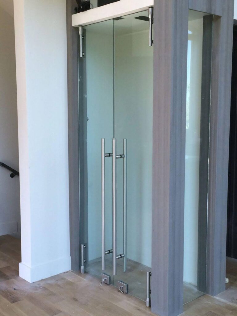 A glass door featuring a sliding door and an additional sliding glass door for easy access and natural light